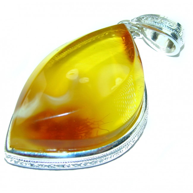 The best quality authentic Golden Baltic Amber .925 Sterling Silver handcrafted pendant