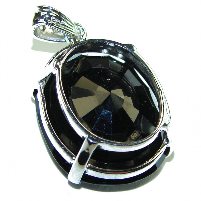 Luxurious oval cut 39.4 carat Deep Blue Sapphire .925 Sterling Silver handcrafted pendant